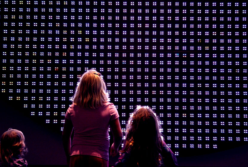 My daughters looking at an LED exhibit at Discovery Place